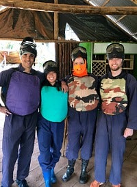 Interns dressed up for paintballing in Uganda