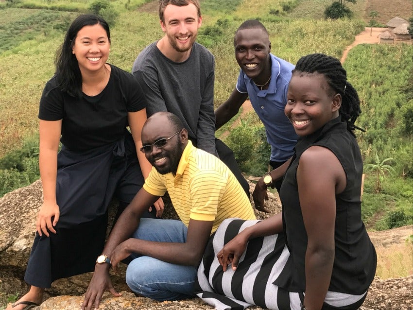 Grady and Carrie with local Ugandans in the field