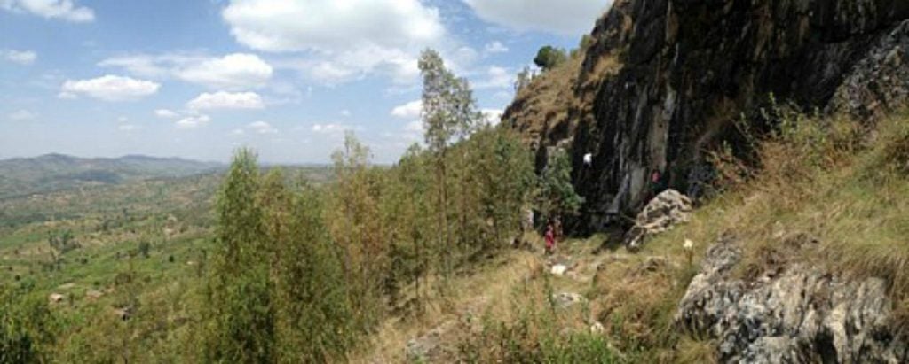 Jimmy rock climbing with friends outside the city in Rwanda