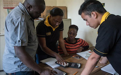 field team looking at records in an office