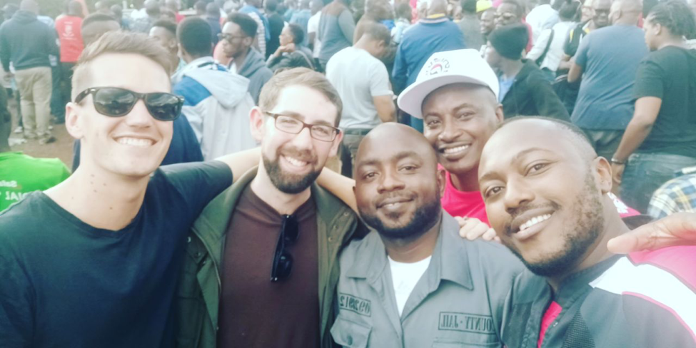 Adam with Connor and Josiah at a rugby match in Kenya