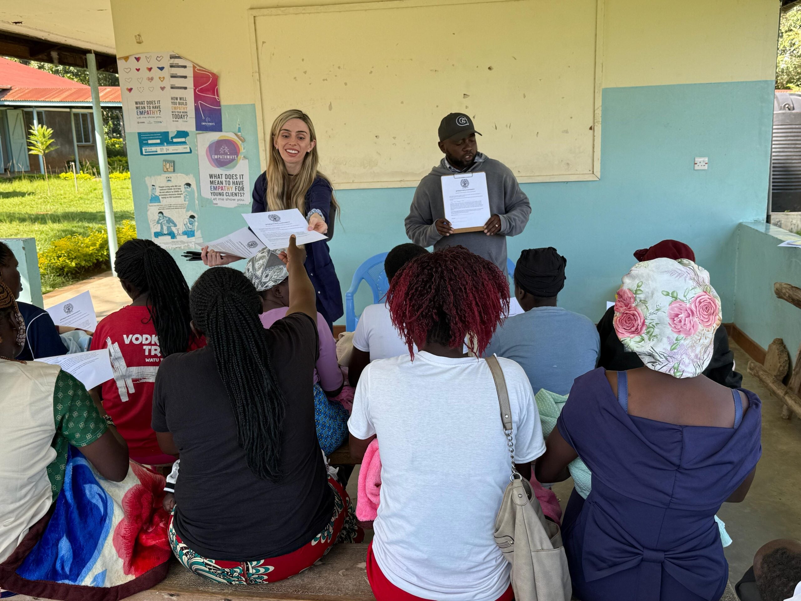 student passing out research flyers