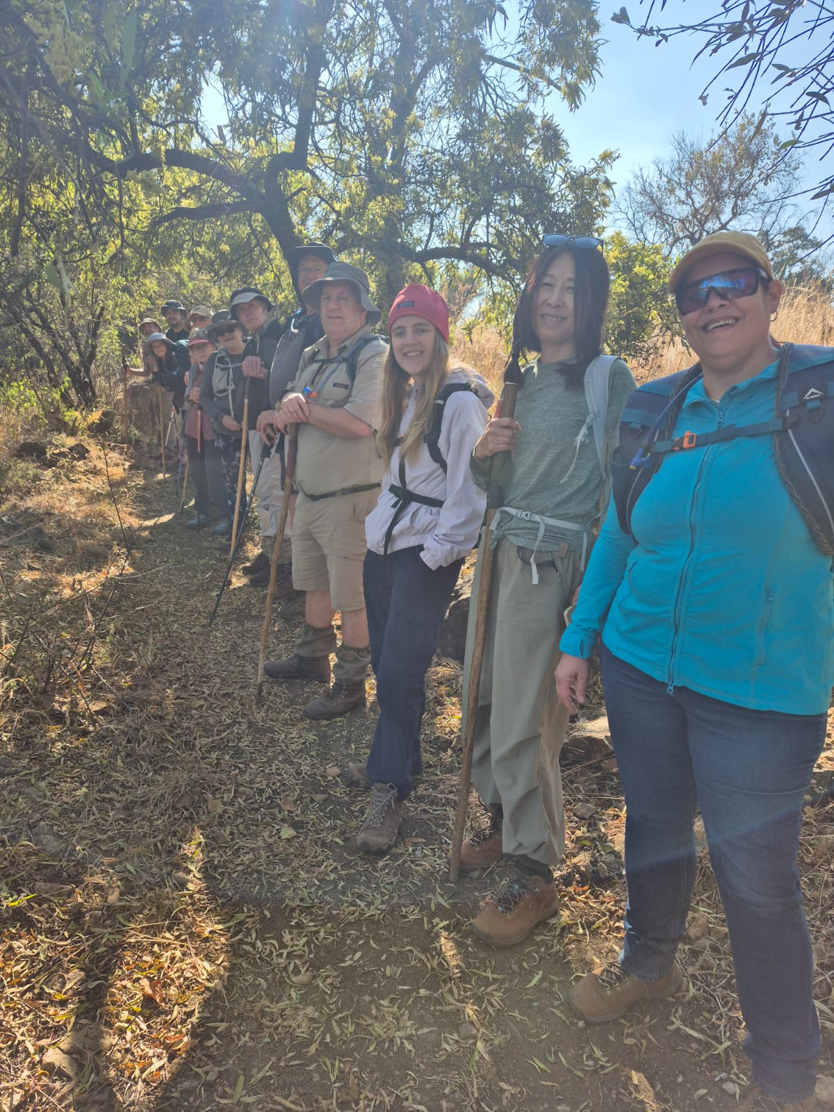 A group of people outside during a hike