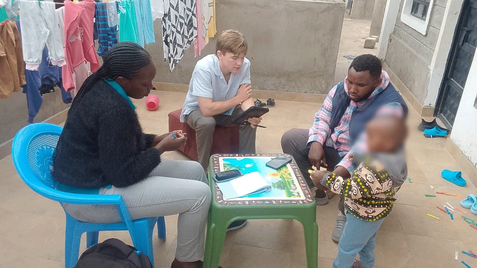 Luke Kuller speaks with two Nairobi parents